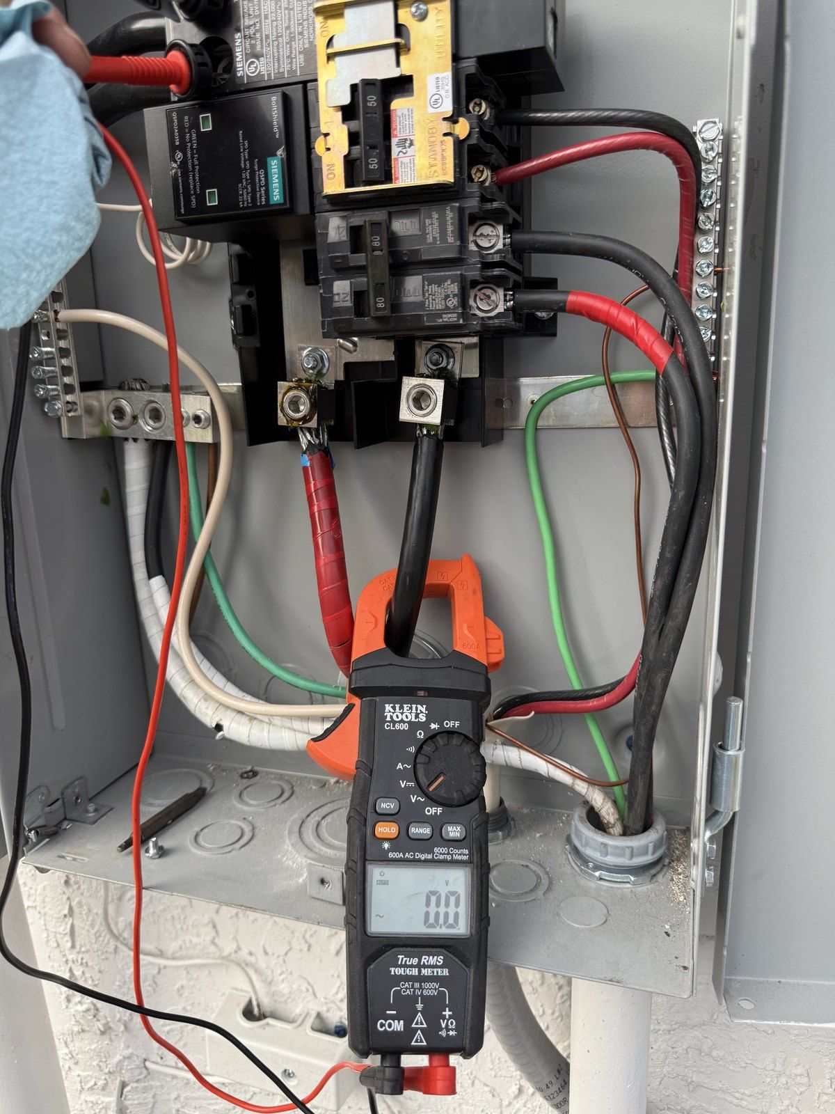 Clamp meter testing a brand-new panel — troubleshooting a utility feed that was not delivering 240 volts, Palm Coast