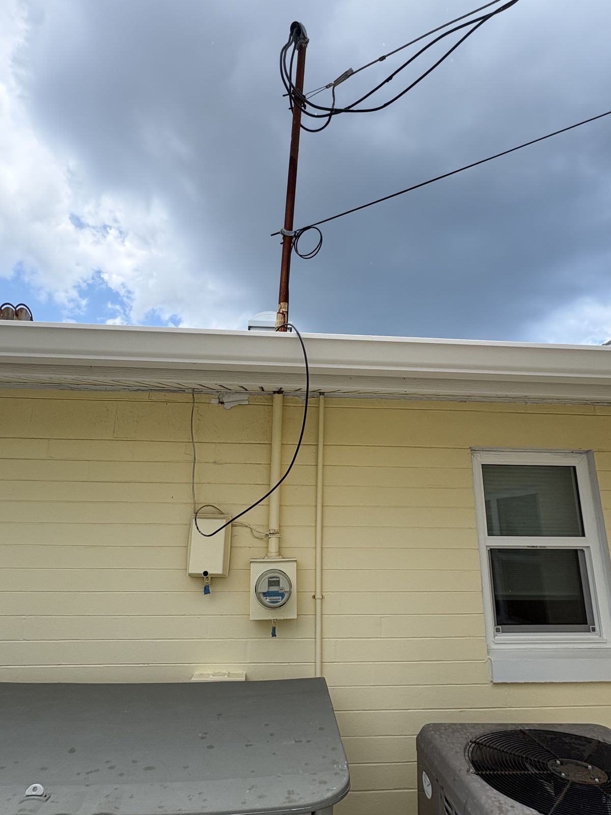 Before: salt-air-rusted meter — replaced with a 200A meter main in Ormond-by-the-Sea