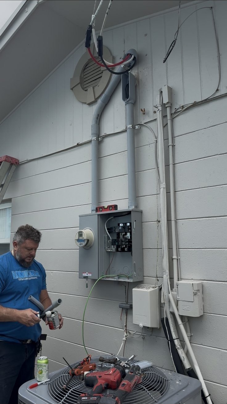 Mike installing new risers during a service upgrade in Flagler Beach