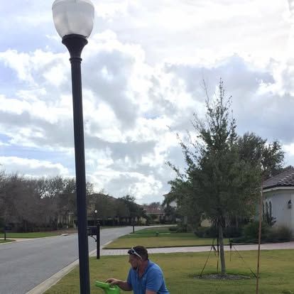 Repairing a community street light in Hammock Dunes