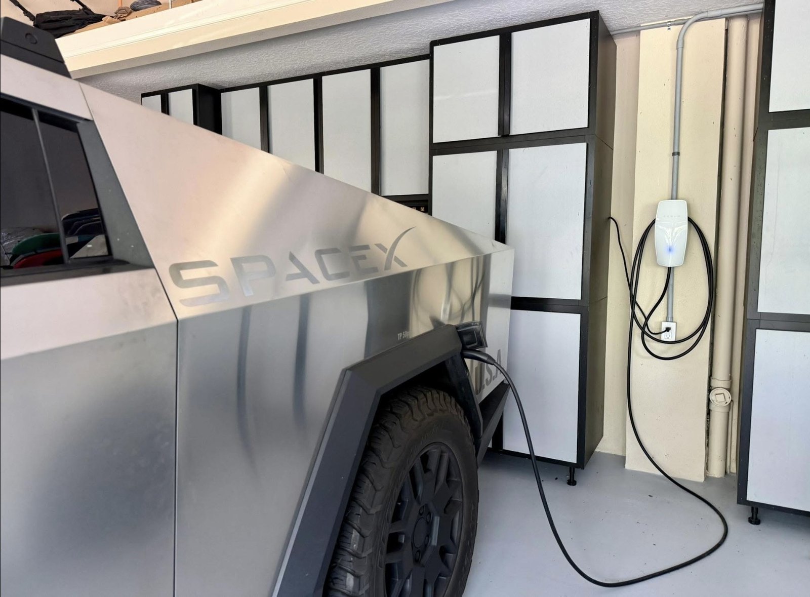 Tesla Wall Connector EV charger install with a Cybertruck charging — Hammock Beach, off A1A